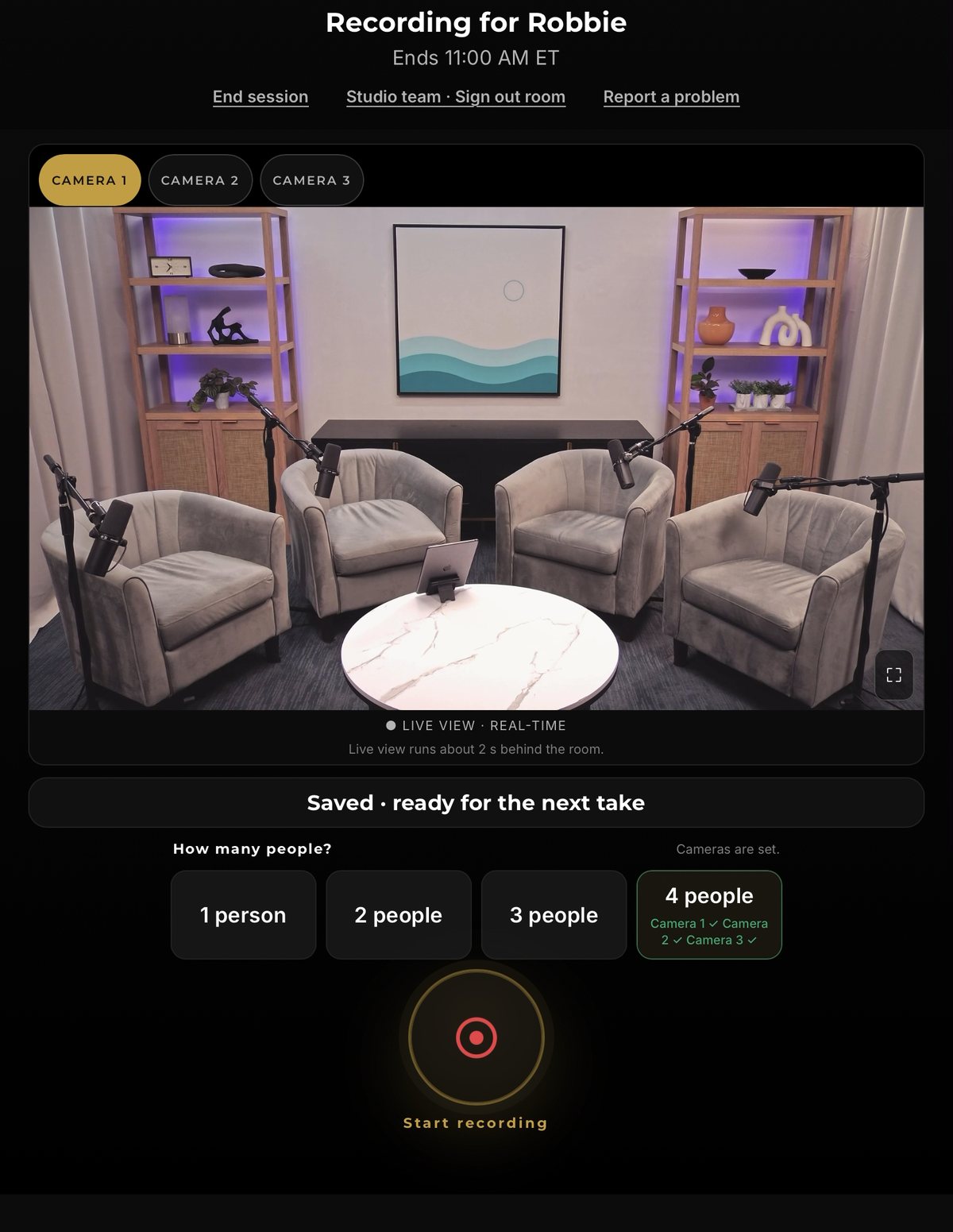 The in-room kiosk during a session: live camera view of the studio, one-tap presets for one to four people, and the record button